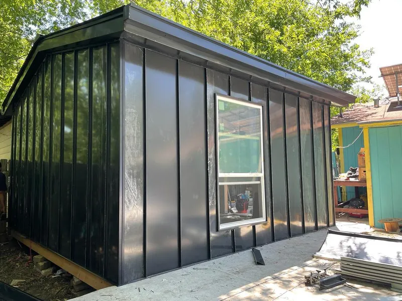 Black standing seam metal wall panels for Roof Inspection in Orangeburg