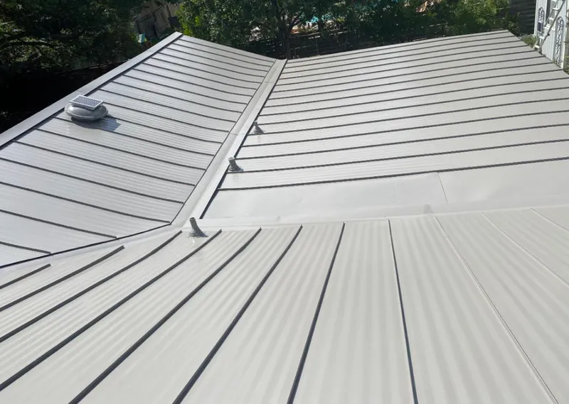 Solar attic fan installed on a metal roof for Roof Ventilation in Orangeburg